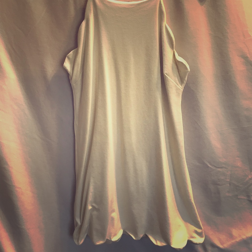 White sleeveless dress with scalloped bottom